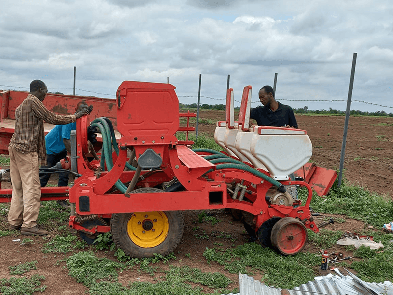Mechanized planter preparing a field for seeding